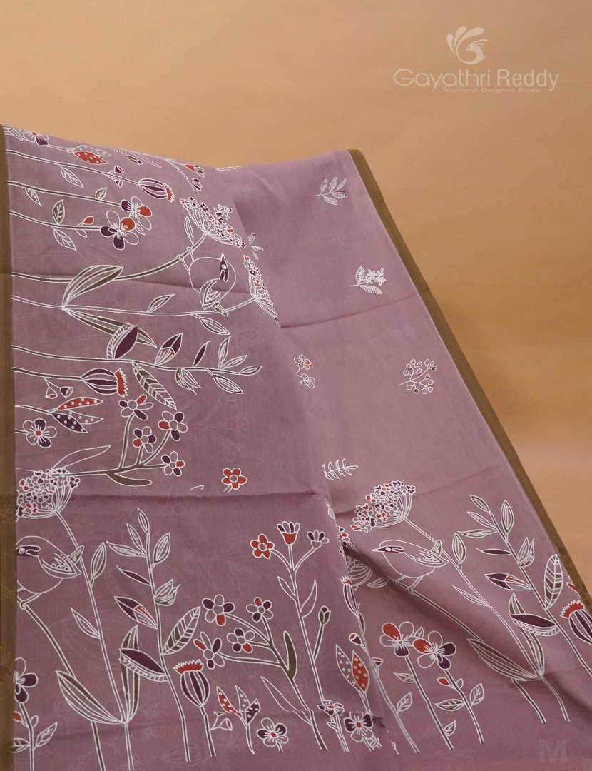 Detailed view of the contrasting blouse and pallu, adding striking visual appeal to the saree.