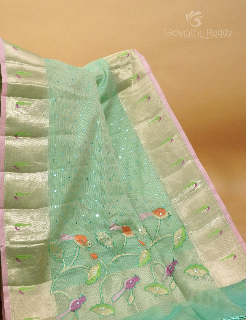 Mint green Banaras Kota saree by Gayathri Reddy, draped for festive and formal occasions.