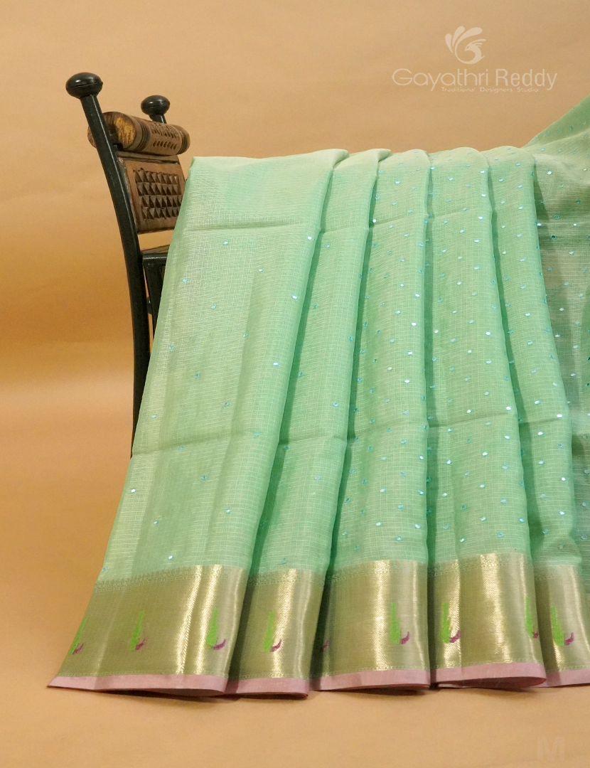 Mint green Banaras Kota saree by Gayathri Reddy, featuring intricate zari work and lightweight Kota fabric.