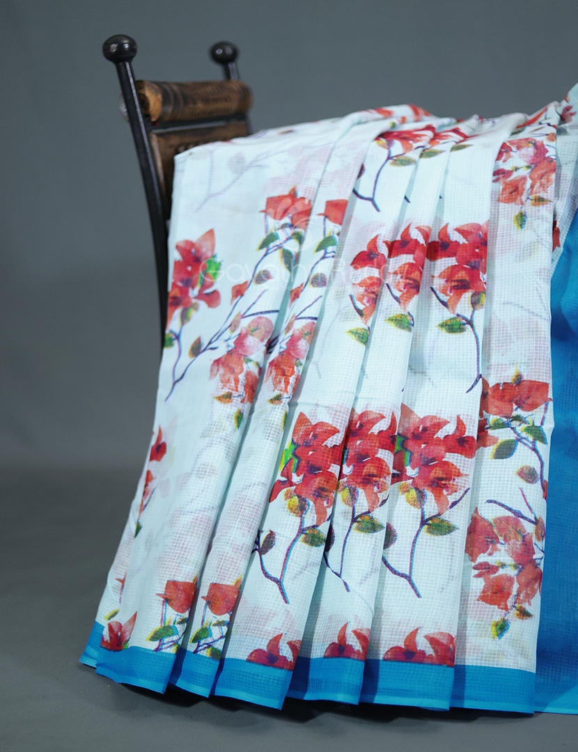 Powder blue and sky blue Munga cotton saree with floral print, lightweight and perfect for daily or office wear.